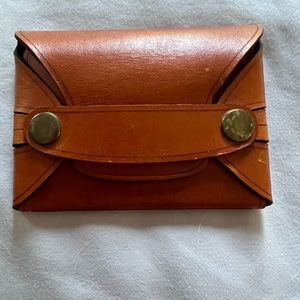Brown leather card holder, used